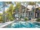 Expansive pool with deck near home and marsh at 26 Cormorant Island Ln, Kiawah Island, SC 29455