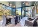 Relaxing screened porch with wood flooring and outdoor seating at 26 Cormorant Island Ln, Kiawah Island, SC 29455