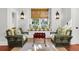Peaceful sitting area with wicker chairs, window seat, and a wood-framed tray at 26 Cormorant Island Ln, Kiawah Island, SC 29455