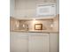 Basement wet bar with microwave and mini-fridge at 26 Cormorant Island Ln, Kiawah Island, SC 29455