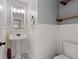 Small bathroom with pedestal sink, decorative tile floor, and floating shelves at 3043 Mapleleaf Dr., Moncks Corner, SC 29461