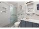 Updated bathroom with marble tile shower and gray vanity at 3043 Mapleleaf Dr., Moncks Corner, SC 29461