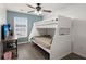 Cozy bedroom with a white bunk bed and wood-look floors at 3043 Mapleleaf Dr., Moncks Corner, SC 29461