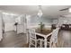 Open dining area with a farmhouse table and view into the living room at 3043 Mapleleaf Dr., Moncks Corner, SC 29461