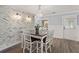 Charming dining area with a stone accent wall and a farmhouse table at 3043 Mapleleaf Dr., Moncks Corner, SC 29461