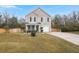 Tan two-story house with a covered porch and landscaped yard at 3043 Mapleleaf Dr., Moncks Corner, SC 29461