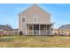 Tan house with screened porch and fenced backyard at 3043 Mapleleaf Dr., Moncks Corner, SC 29461