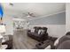 Open living space with gray walls, hardwood floors, and comfy seating at 3043 Mapleleaf Dr., Moncks Corner, SC 29461