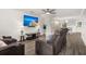 Spacious living room with hardwood floors, two comfy recliners and a large TV at 3043 Mapleleaf Dr., Moncks Corner, SC 29461