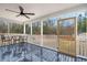 Relaxing screened porch with wood floor and table at 3043 Mapleleaf Dr., Moncks Corner, SC 29461