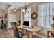 Bright dining area with a computer workspace and large windows at 329 Flyway Rd, Goose Creek, SC 29445