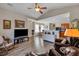 Open concept living room and kitchen with hardwood floors at 329 Flyway Rd, Goose Creek, SC 29445