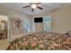 Main bedroom with a floral comforter, dresser and walk-in closet at 329 Flyway Rd, Goose Creek, SC 29445