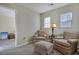 Cozy sitting room with two armchairs, ottoman, and a lamp at 329 Flyway Rd, Goose Creek, SC 29445