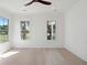 Bright bedroom with hardwood floors and large windows offering scenic views at 3315 Hopkinson Plantation Rd, Johns Island, SC 29455
