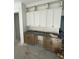Well-appointed butler's pantry with shaker cabinets and granite countertops at 3315 Hopkinson Plantation Rd, Johns Island, SC 29455