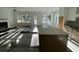 Kitchen under construction with island and new hardwood floors at 3315 Hopkinson Plantation Rd, Johns Island, SC 29455