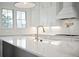 Modern kitchen island with quartz countertop and gold faucet at 3315 Hopkinson Plantation Rd, Johns Island, SC 29455