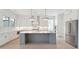 Spacious kitchen with large island, stainless steel appliances, and white shaker cabinets at 3315 Hopkinson Plantation Rd, Johns Island, SC 29455