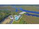 Aerial view of community, highlighting the pool and marsh views at 4007 Capensis Ln, Ravenel, SC 29470