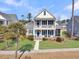 Two-story home with blue shutters and porch at 4007 Capensis Ln, Ravenel, SC 29470