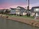Aerial view of houses along a waterway at dusk at 4007 Capensis Ln, Ravenel, SC 29470