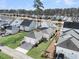Aerial view of houses and a pond at 4007 Capensis Ln, Ravenel, SC 29470