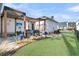 Backyard with pergola, grill, and artificial turf at 4007 Capensis Ln, Ravenel, SC 29470