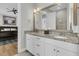 Double vanity bathroom with granite countertop, large mirror, and walk-in shower at 4007 Capensis Ln, Ravenel, SC 29470