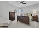 Bright bedroom with a double bed, dresser, and an armchair at 4007 Capensis Ln, Ravenel, SC 29470