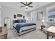 Bedroom with a queen-size bed, window seating, and a ceiling fan at 4007 Capensis Ln, Ravenel, SC 29470