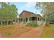 Charming community clubhouse with welcoming porch and landscaping at 4007 Capensis Ln, Ravenel, SC 29470