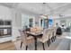 Open dining room with large table and view of the living room at 4007 Capensis Ln, Ravenel, SC 29470