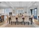 Spacious dining area with large table and access to kitchen at 4007 Capensis Ln, Ravenel, SC 29470