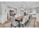 Bright dining room featuring a formal table and access to kitchen at 4007 Capensis Ln, Ravenel, SC 29470