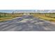 Long driveway leads to a stunning barn with gray metal roof and white siding at 4007 Capensis Ln, Ravenel, SC 29470