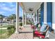 Relaxing front porch with pond view at 4007 Capensis Ln, Ravenel, SC 29470
