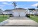 Two-car garage with driveway at 4007 Capensis Ln, Ravenel, SC 29470