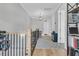 Upper hallway with built-in shelving, a patterned rug, and access to bedrooms at 4007 Capensis Ln, Ravenel, SC 29470