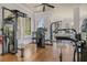 Bright home gym with various weight machines and free weights at 4007 Capensis Ln, Ravenel, SC 29470
