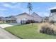 Two-story house with detached garage and fenced backyard at 4007 Capensis Ln, Ravenel, SC 29470