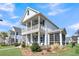 Two-story house with front porch and landscaping at 4007 Capensis Ln, Ravenel, SC 29470