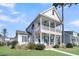 Two-story house with front porch and landscaping at 4007 Capensis Ln, Ravenel, SC 29470