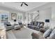 Living room with hardwood floors, comfortable seating, and water views at 4007 Capensis Ln, Ravenel, SC 29470