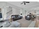 Open living room with leather furniture, hardwood floors, and a staircase at 4007 Capensis Ln, Ravenel, SC 29470