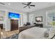 Bright main bedroom with hardwood floors, a large TV, and comfortable seating at 4007 Capensis Ln, Ravenel, SC 29470