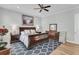 Main bedroom with dark wood sleigh bed, hardwood floors and blue rug at 4007 Capensis Ln, Ravenel, SC 29470