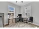 Home office with a desk, chair, and ample natural light at 4007 Capensis Ln, Ravenel, SC 29470