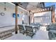 Relaxing patio with pergola, seating, fire pit, and grill at 4007 Capensis Ln, Ravenel, SC 29470