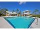 Community pool with adjacent lounge area and cabana at 4007 Capensis Ln, Ravenel, SC 29470